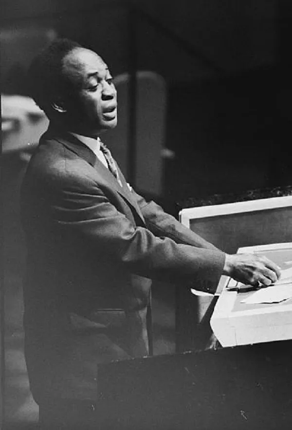 Kwame Nkrumah Delivering a Public Address Kwame Nkrumah speaks at a lectern during a formal public address in a black-and-white photograph.
